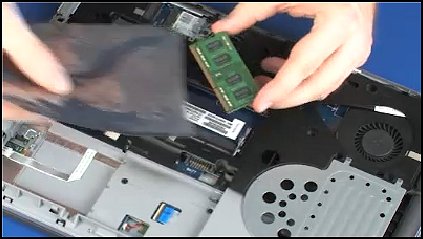 Grasping the memory module by the edges and removing it from the bag