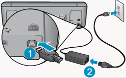 Image of power cord and adapter being plugged in.