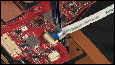 Disconnecting the power button board ribbon cable