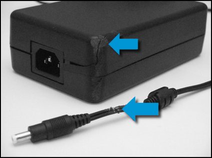 Chipped and cracked AC adapter and damaged cord