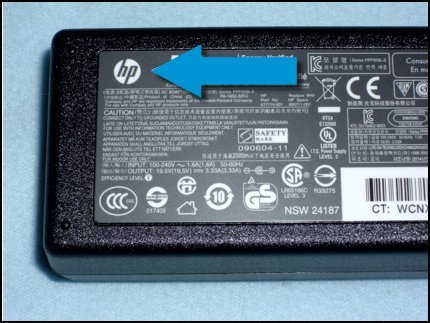 HP logo on the power adapter indicating it is a genuine HP part