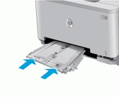 Image: Push the single-sheet feed tray back into the printer