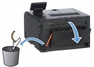 Image: Remove and discard the orange packing strip from inside the printer
