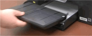 Image: Tilt the tray upward and pull it away from the printer.