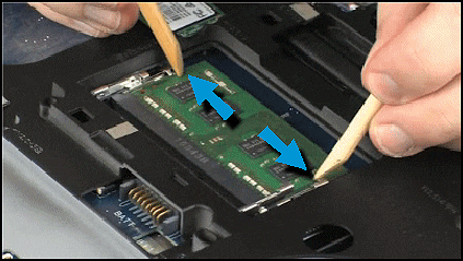 Pushing the retention arms out to release the memory module