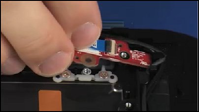 Placing the power button board onto the alignment pins