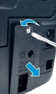 Using a screwdriver to remove a replaceable power module