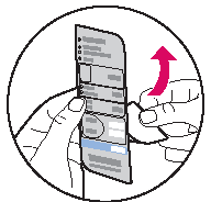 Hold the bottom tab and peel upward to remove the backing from the overlay.