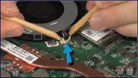 Disconnecting the fan cable from the system board