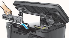 Image: Remove the toner cartridge, and set it aside in a secure place.