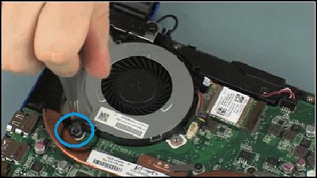 Removing the screws that secure the fan to the system board