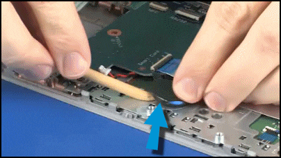 Prying the battery off the touchpad button bracket